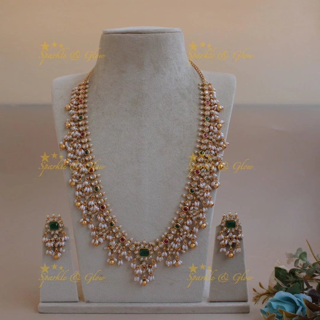 Exclusive floral design gutta pusalu long necklace with ruby emerald white stones and rice pealrs - Sparkle and Glow