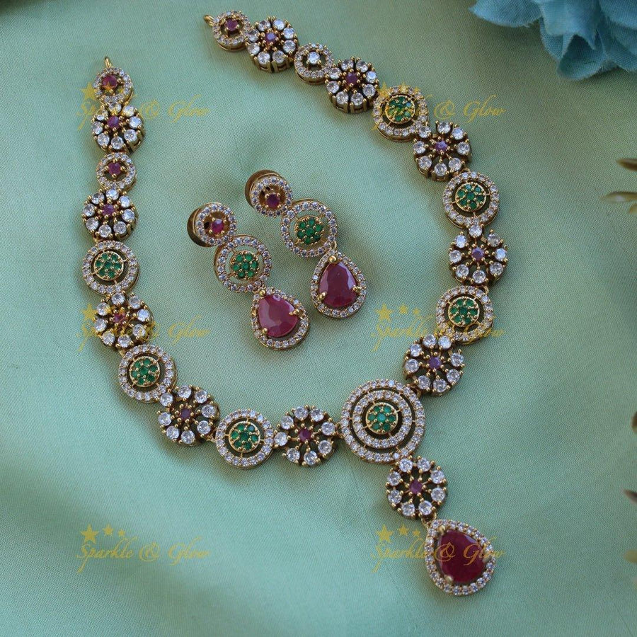 Statement Floral and spiral design AD short necklace with ruby and emerald stones - Sparkle and Glow