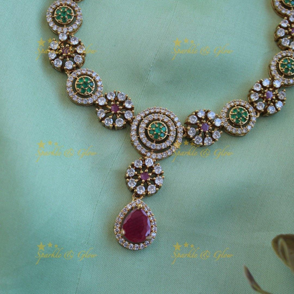 Statement Floral and spiral design AD short necklace with ruby and emerald stones - Sparkle and Glow