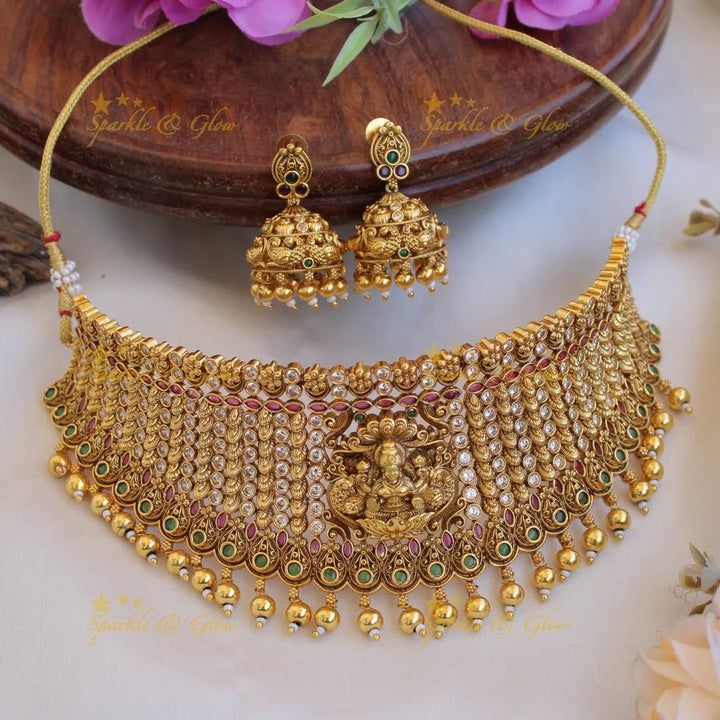 Gorgeous Lakshmi peacock carved gold alike choker with multi colour stones and gold beads - Sparkle and Glow