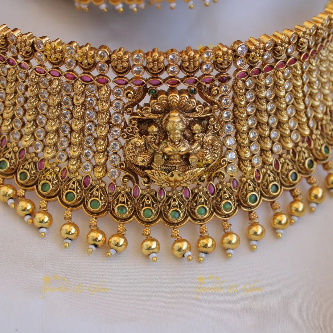 Gorgeous Lakshmi peacock carved gold alike choker with multi colour stones and gold beads - Sparkle and Glow