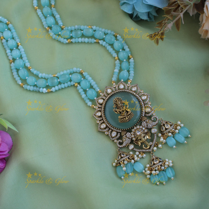 Lakshmi Ganeha carved stone pendant Victorian AD haram with multi layer beads chain and jhumuka drops - sea blue