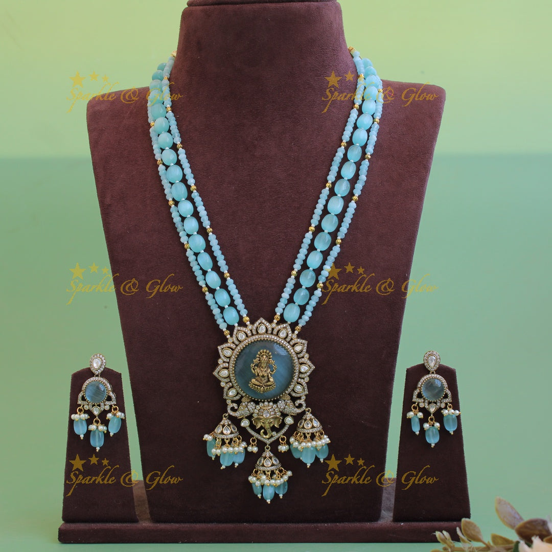 Lakshmi Ganeha carved stone pendant Victorian AD haram with multi layer beads chain and jhumuka drops - sea blue