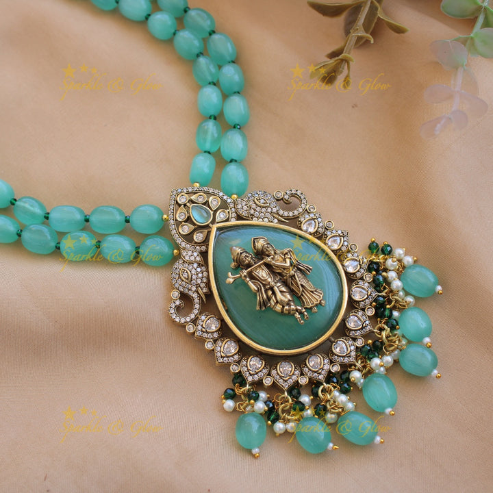 Elegant Radha krishna carved pendant Victorian AD haram with two layer sea blue beads chain