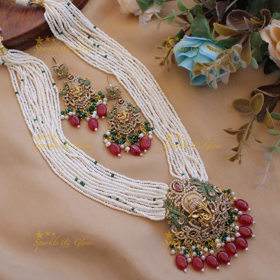 Ganesha peacock carved pendant Victorian AD haram with multi layer pearl red beads chain with green beads