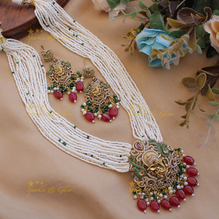 Ganesha peacock carved pendant Victorian AD haram with multi layer pearl red beads chain with green beads
