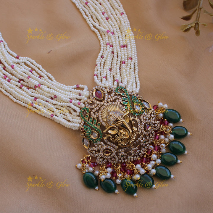 Ganesha peacock carved pendant Victorian AD haram with multi layer pearl red beads chain with green beads