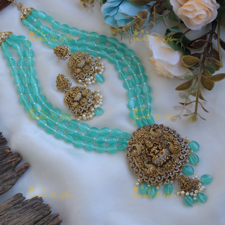 Beautiful Lakshmi peacock carved pendant Victorian AD haram with multi layer sea blue beads chain