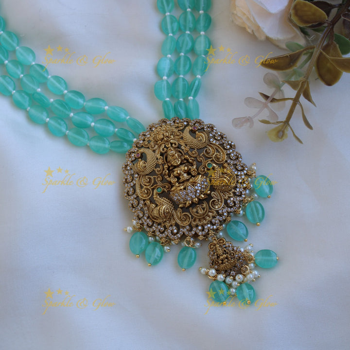 Beautiful Lakshmi peacock carved pendant Victorian AD haram with multi layer sea blue beads chain