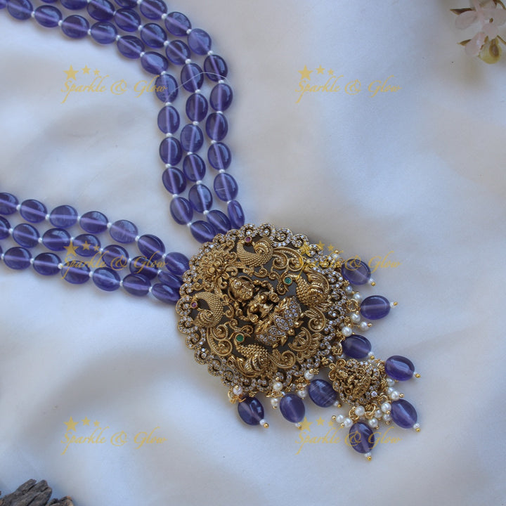 Beautiful Lakshmi peacock carved pendant Victorian AD haram with multi layer purple beads chain