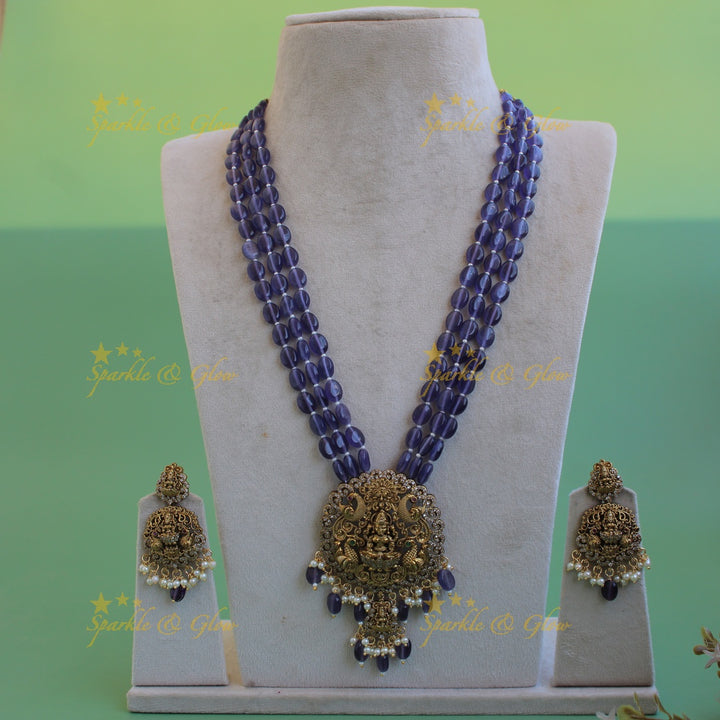 Beautiful Lakshmi peacock carved pendant Victorian AD haram with multi layer purple beads chain