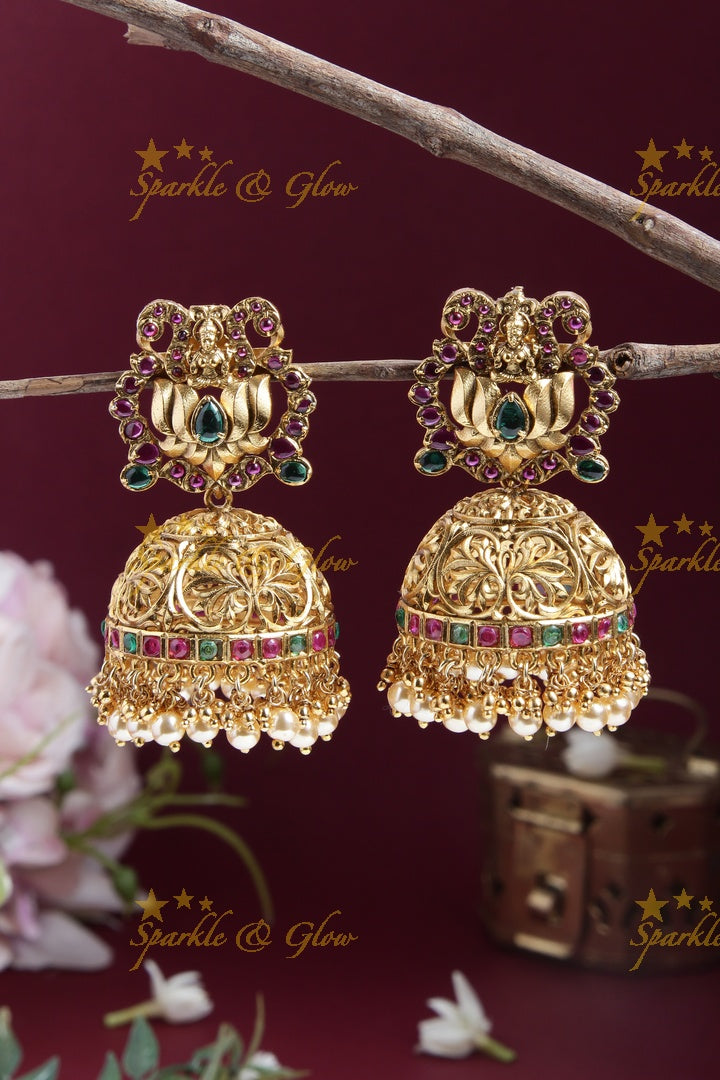 Grand Gold alike Lakshmi lotus carved jhumukas with ruby emerald and pearls