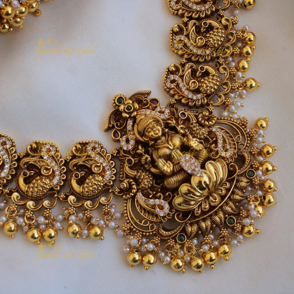 Gorgeous Lakshmi peacock carved long necklace with CZ stones pearls and gold beads - Sparkle and Glow