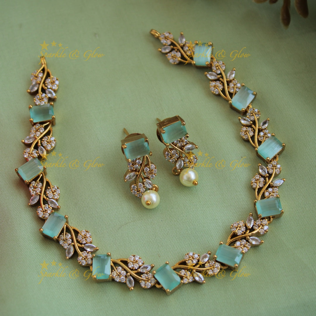 Elegant floral and leaf design AD short necklace with ruby and emerald stones