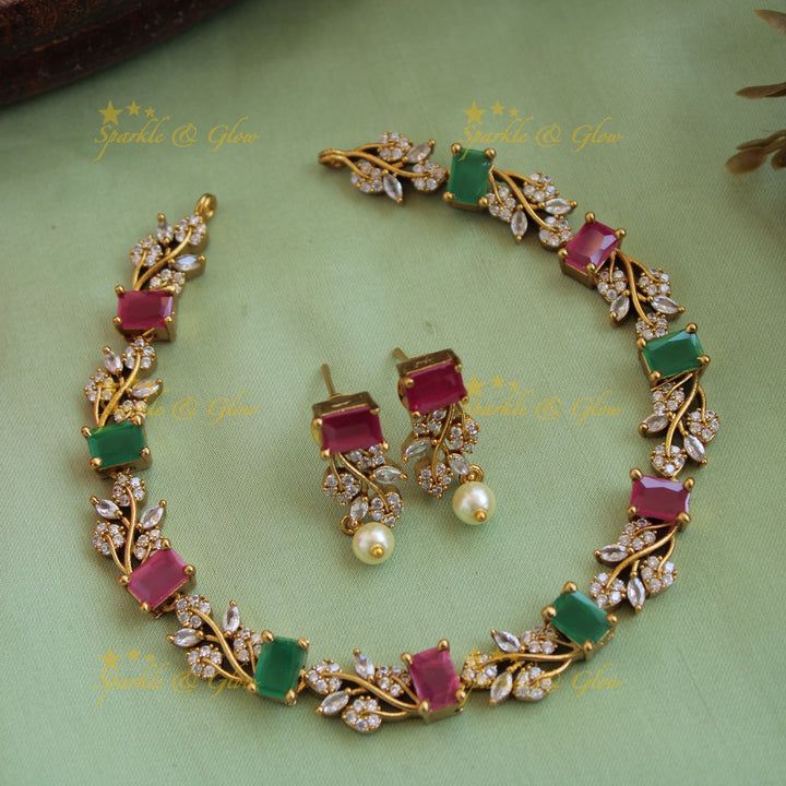 Elegant floral and leaf design AD short necklace with ruby and emerald stones