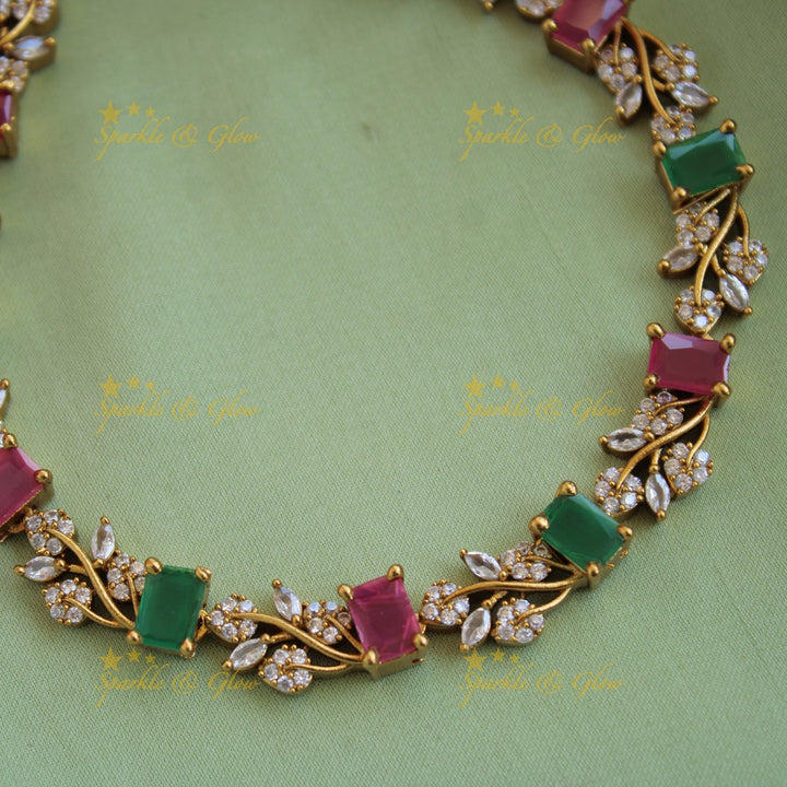 Elegant floral and leaf design AD short necklace with ruby and emerald stones