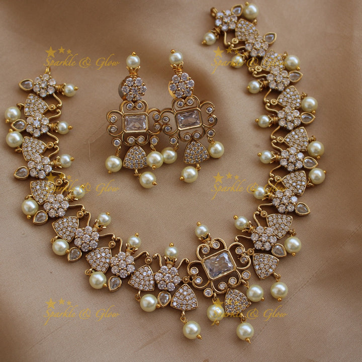 Beautiful floral and triangle design AD short necklace with ruby stones - pink