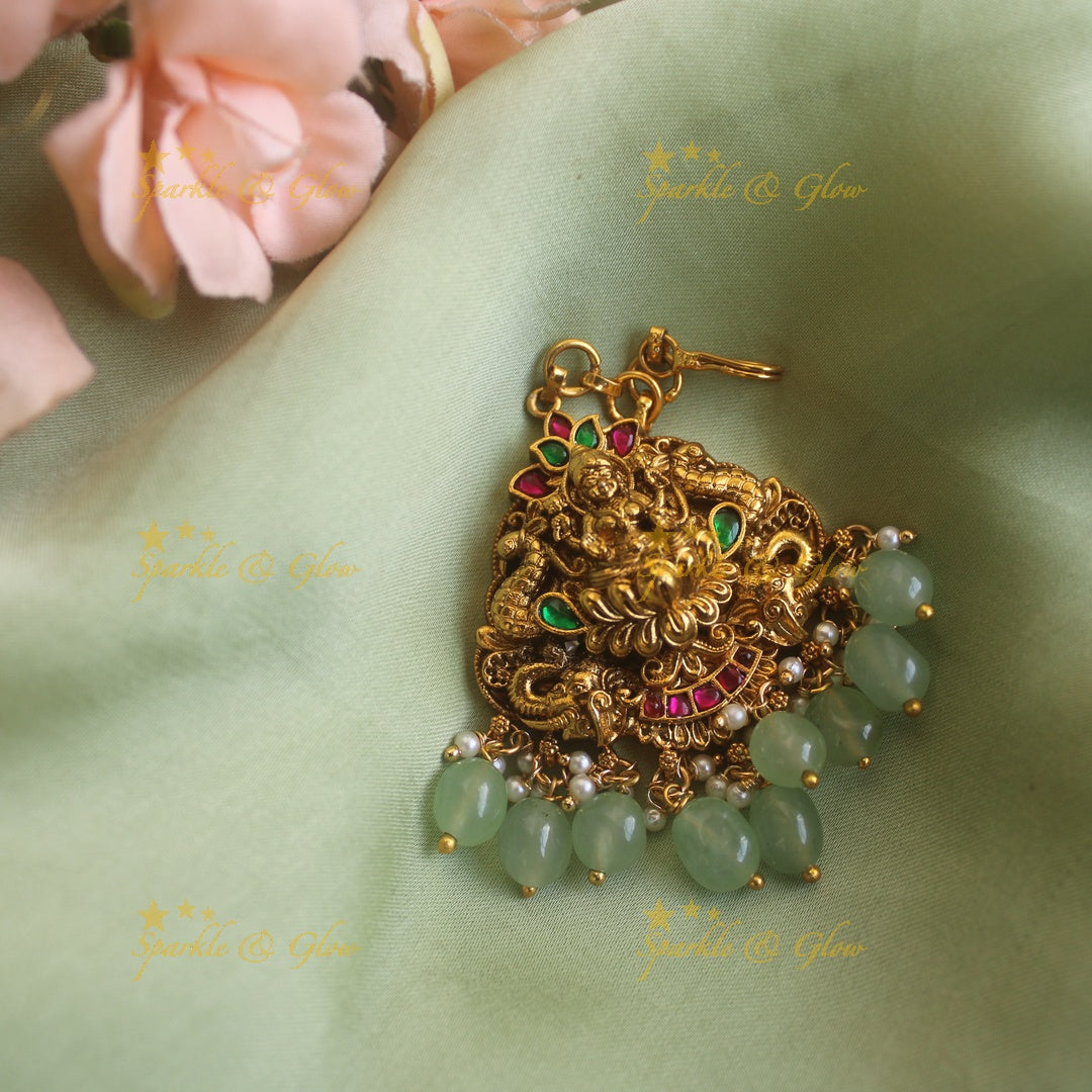 Exclusive lakshmi elephant peacock carved jadau maang tikka with mintgreen beads