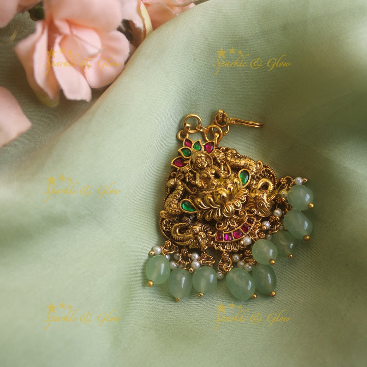 Exclusive lakshmi elephant peacock carved jadau maang tikka with mintgreen beads