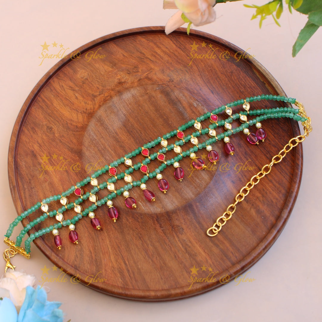 Elegant layer green beads and kundan choker with pink bead drops