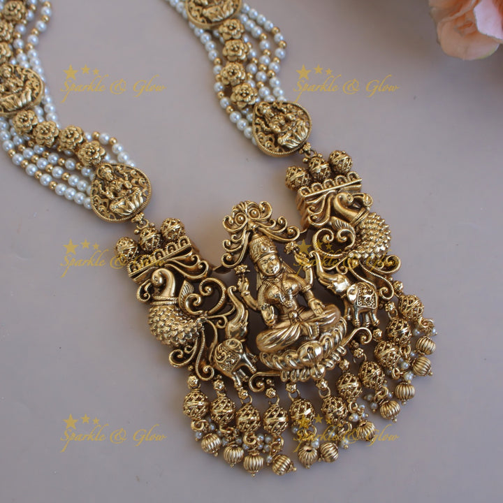 Gorgeous Lakshmi peacock elephant carved pendant multi layer pearl haram with gold beads - pearl