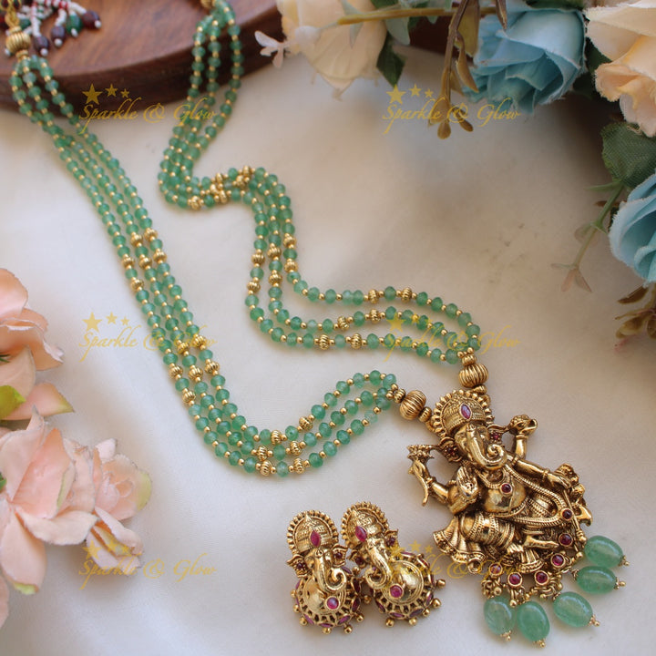 Beautiful Ganesha carved pendant multi layer gold and mint green beads haram with emerald