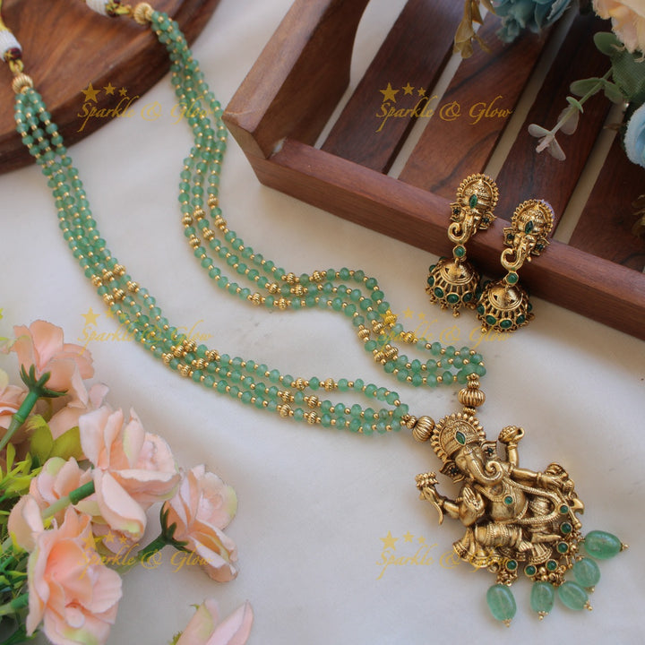 Beautiful Ganesha carved pendant multi layer gold and mint green beads haram with emerald