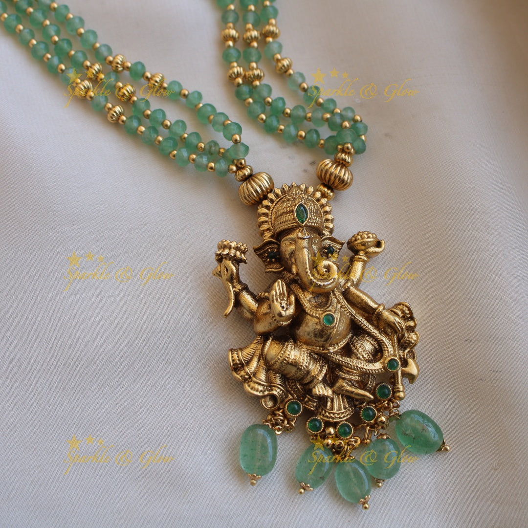 Beautiful Ganesha carved pendant multi layer gold and mint green beads haram with emerald