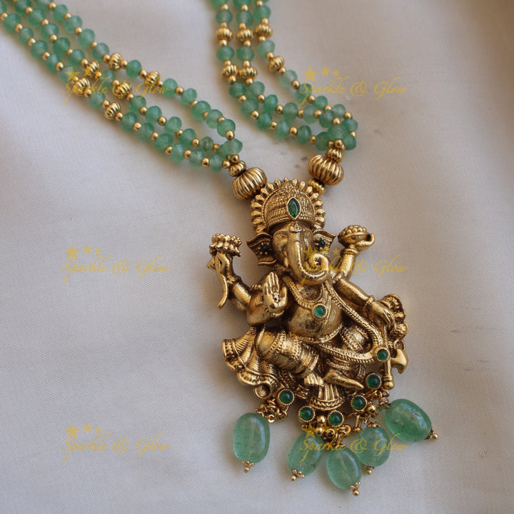Beautiful Ganesha carved pendant multi layer gold and mint green beads haram with emerald