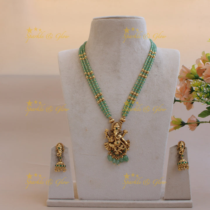 Beautiful Ganesha carved pendant multi layer gold and mint green beads haram with emerald