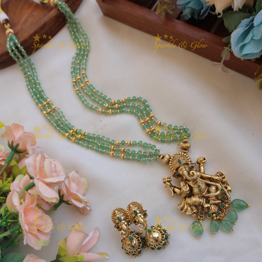 Beautiful Ganesha carved pendant multi layer gold and mint green beads haram with emerald