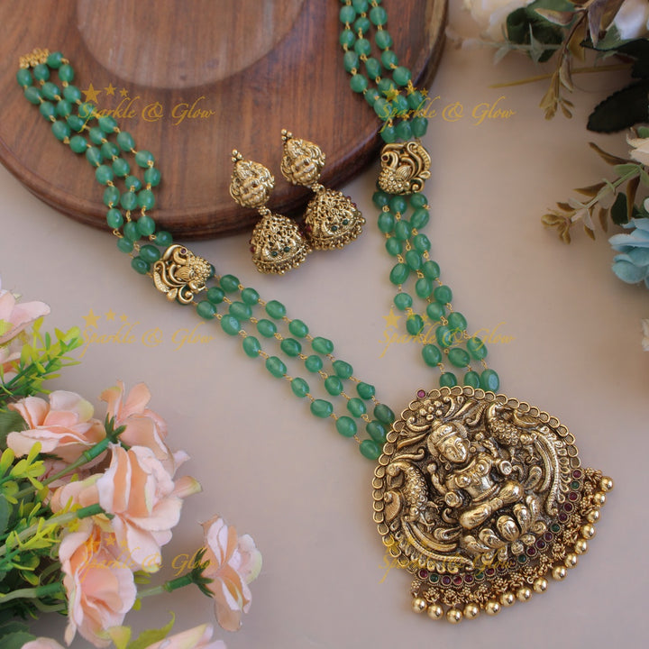 Elegant Lakshmi peacock pendant three layer mint green beads haram with gold beads