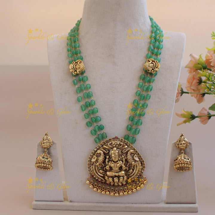 Elegant Lakshmi peacock pendant three layer mint green beads haram with gold beads