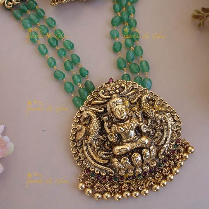 Elegant Lakshmi peacock pendant three layer mint green beads haram with gold beads