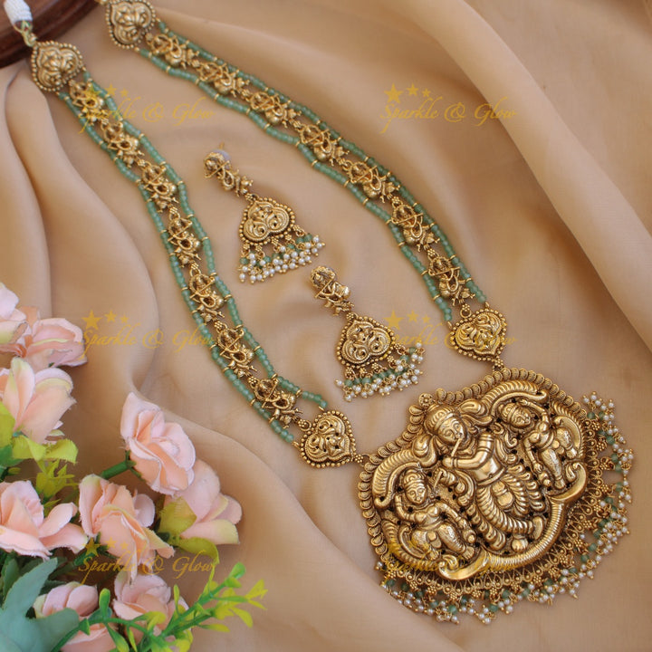 Gorgeous Krishna playing flute carved long necklace with pearls and maroon beads