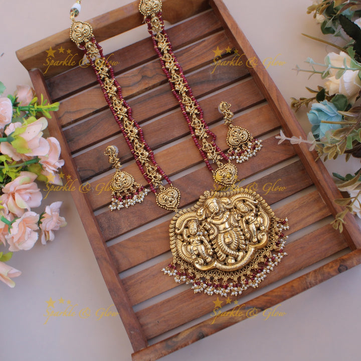 Gorgeous Krishna playing flute carved long necklace with pearls and maroon beads