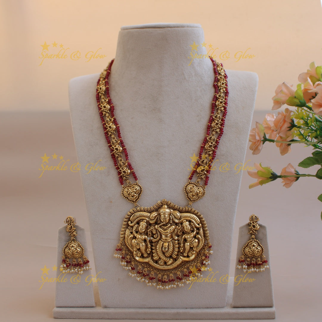 Gorgeous Krishna playing flute carved long necklace with pearls and maroon beads