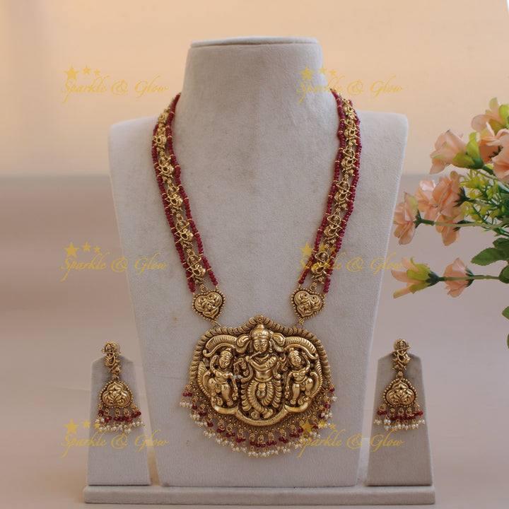 Gorgeous Krishna playing flute carved long necklace with pearls and maroon beads