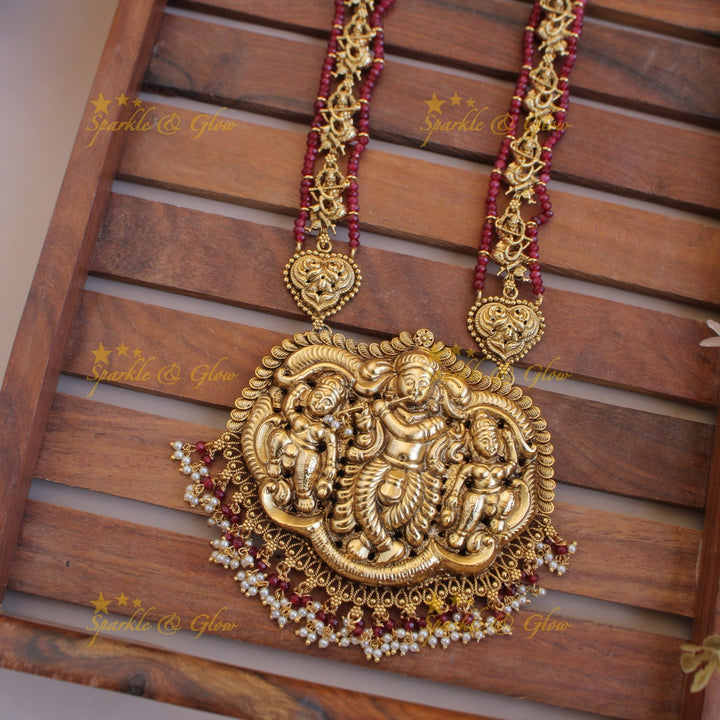 Gorgeous Krishna playing flute carved long necklace with pearls and maroon beads