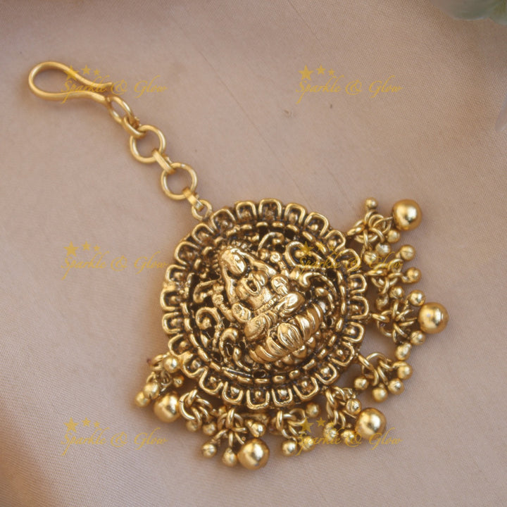 Stunning gold alike lakshmi maang tikka with green beads