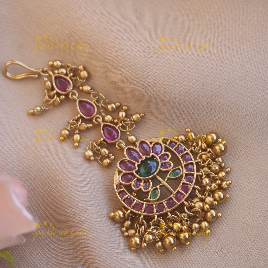 Beautiful gold alike floral designRed green stone with gold beads maang tikka