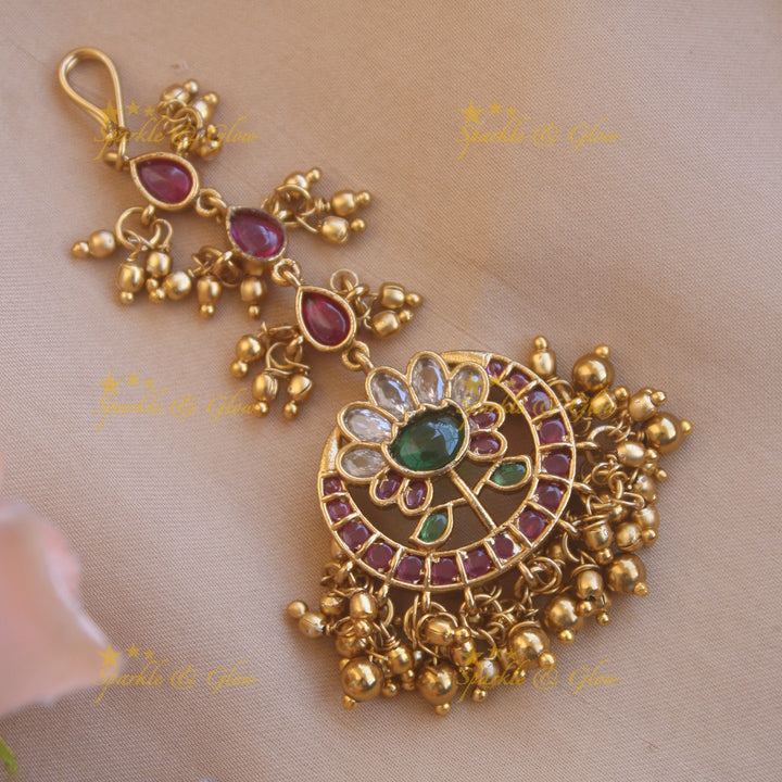 Beautiful gold alike floral designRed green stone with gold beads maang tikka