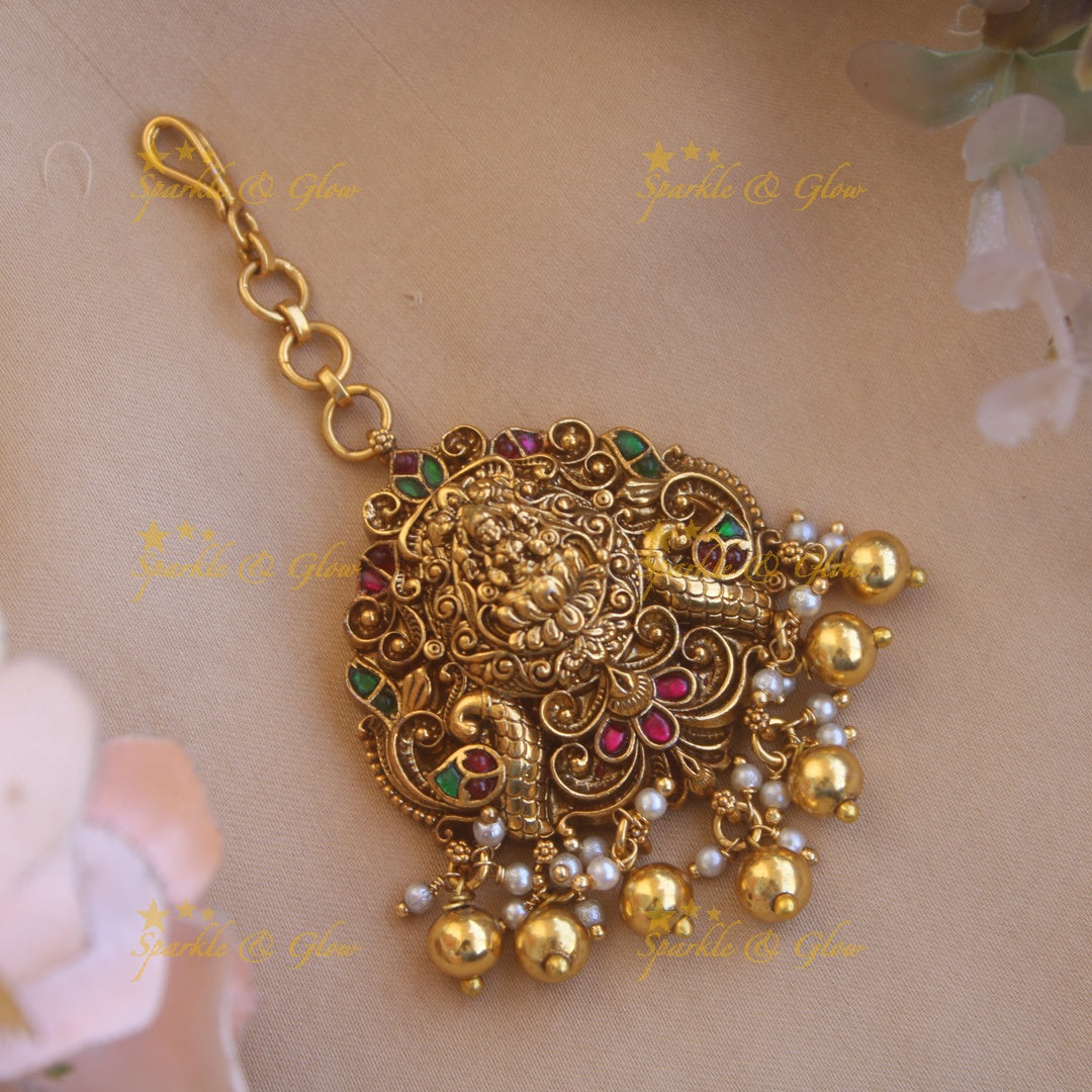 Exclusive jadau lakshmi with gold beads maang tikka