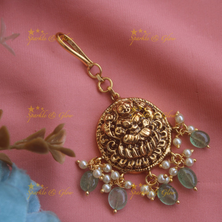 Gold alike Lakshmi maang tikka with pearls and mint green beads