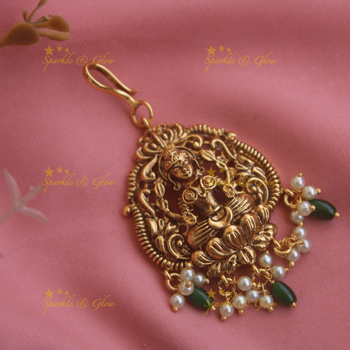 Beautiful Lakshmi carved maang tikka with pearls and mint green beads