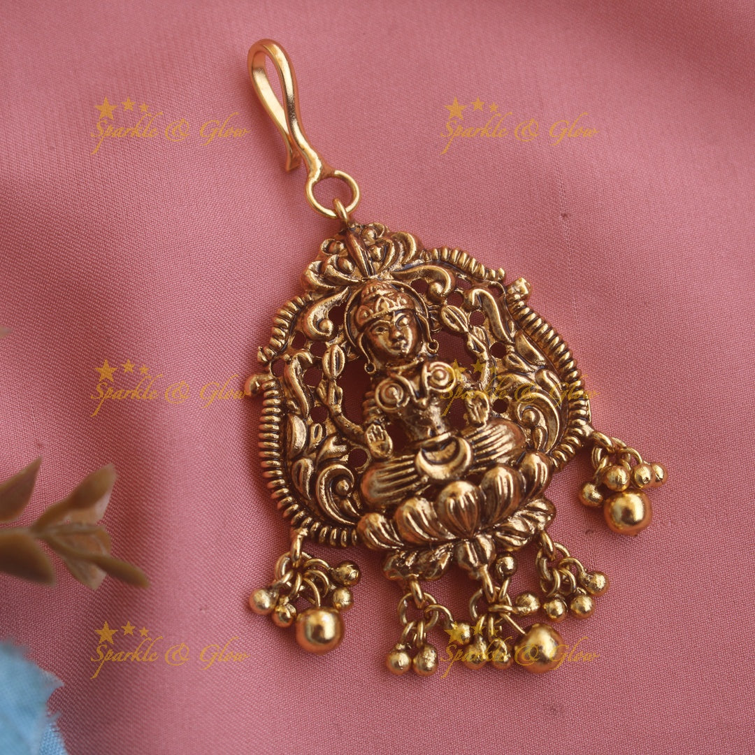 Beautiful Lakshmi carved maang tikka with pearls and mint green beads