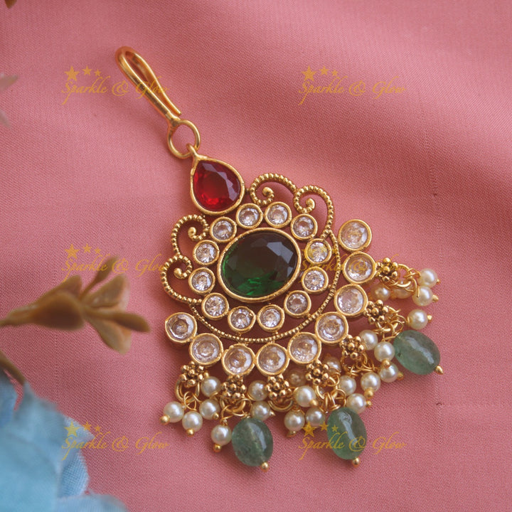 Elegant Floral maang tikka with red green white stones and mint green beads