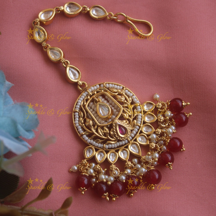 Statement floral leaf design kundan maang tikka with pearls and maroon beads