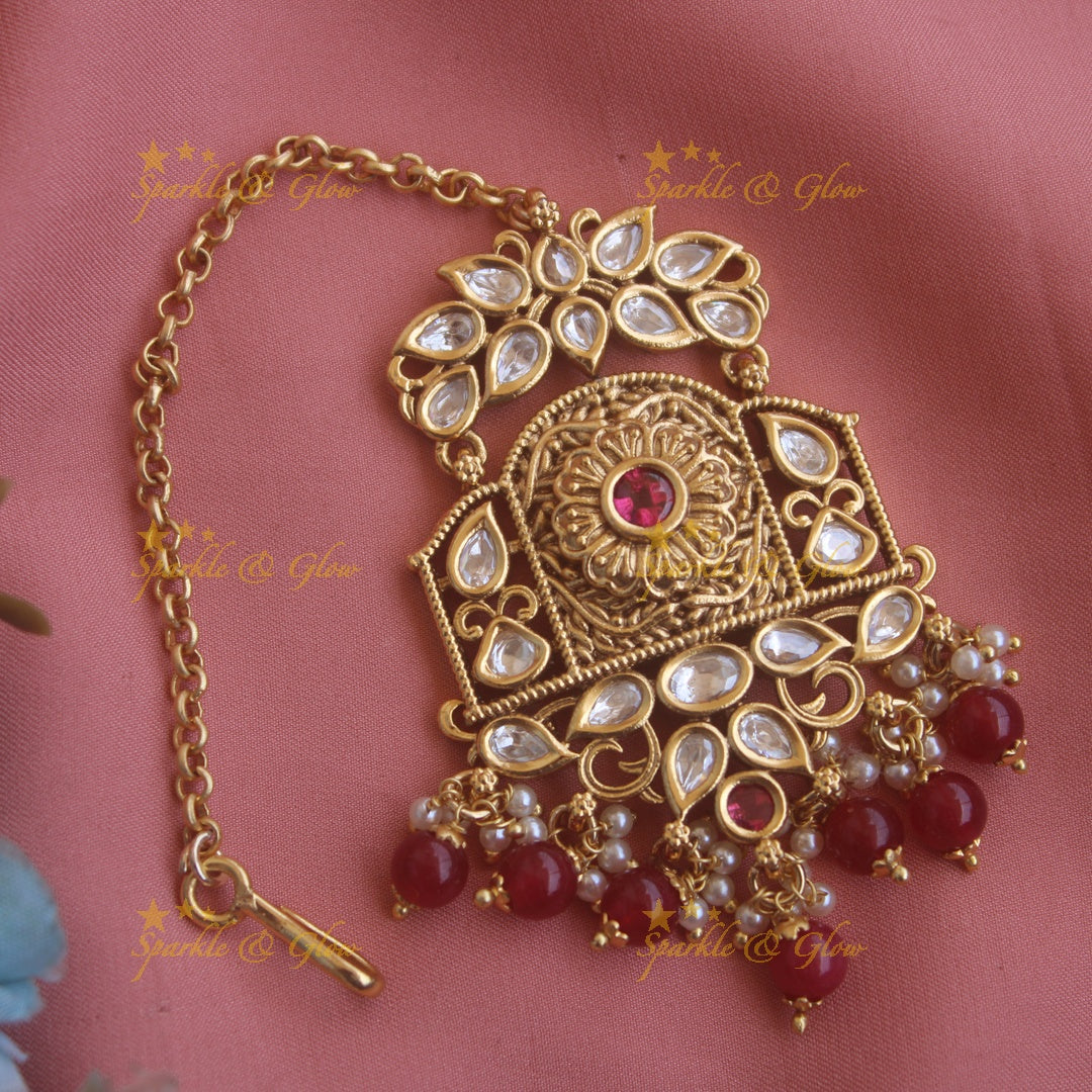 Grand floral leaf carved kundan maang tikka with pearls and green beads
