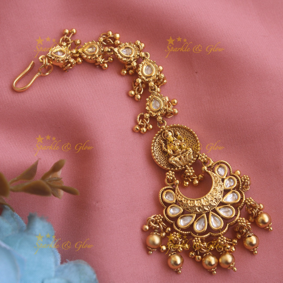 Beautiful Lakshmi half moon jadau maang tikka with red beads